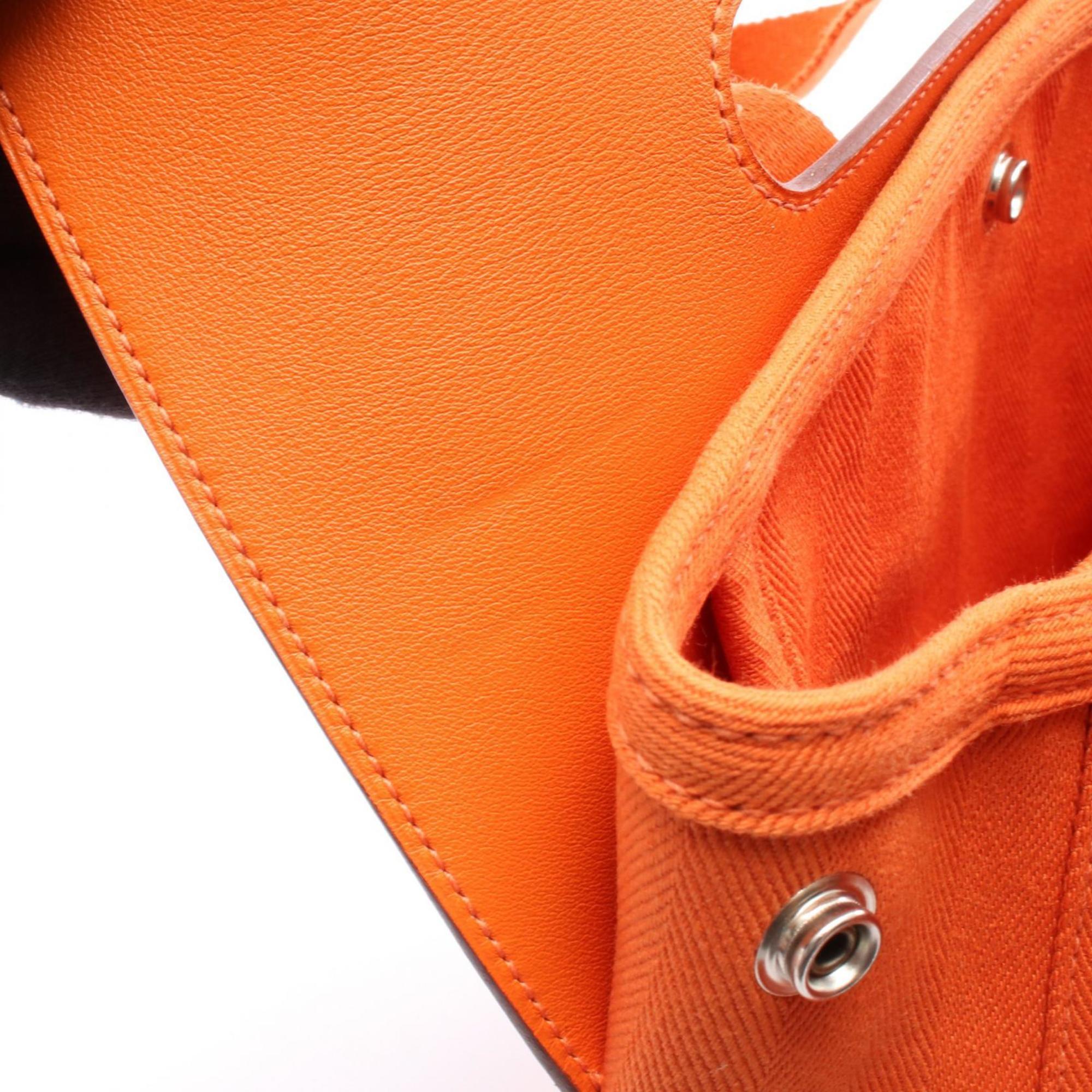 HMS Hermès Valparaiso PM handbag in leather and canvas with Toile Chevron detailing, orange.